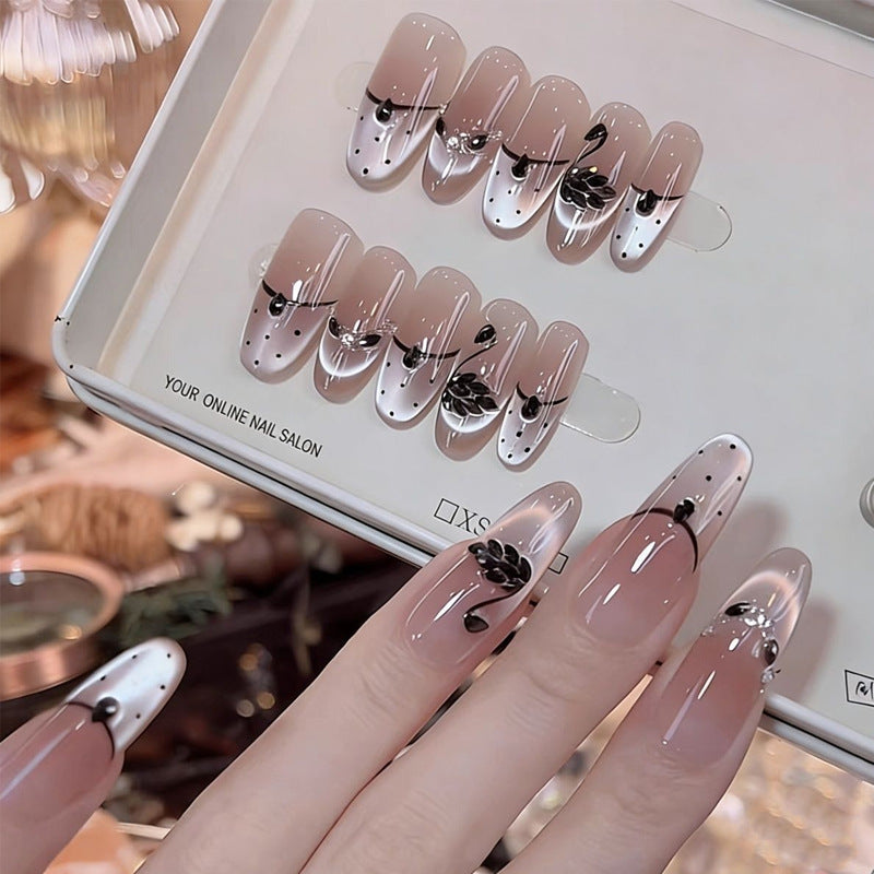 Artificial nails with floral accents and elegant shine Stornfield