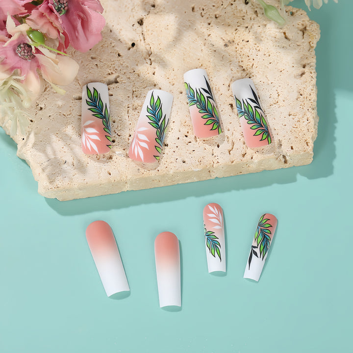 Artificial nails with elegant ombre design and floral accents Stornfield