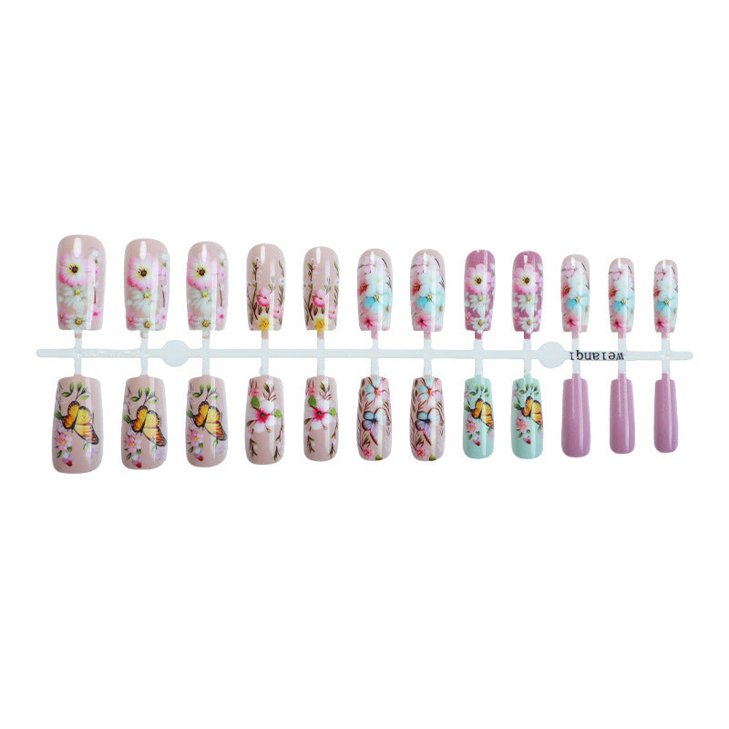 Artificial nail set with floral motifs and butterfly design Stornfield