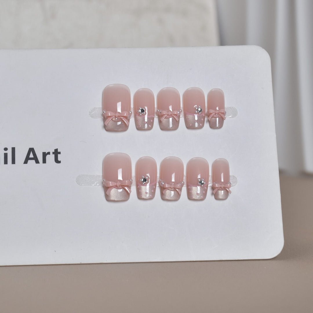 Elegant French Tip Press-On Nail Art with Bow Accents Stornfield