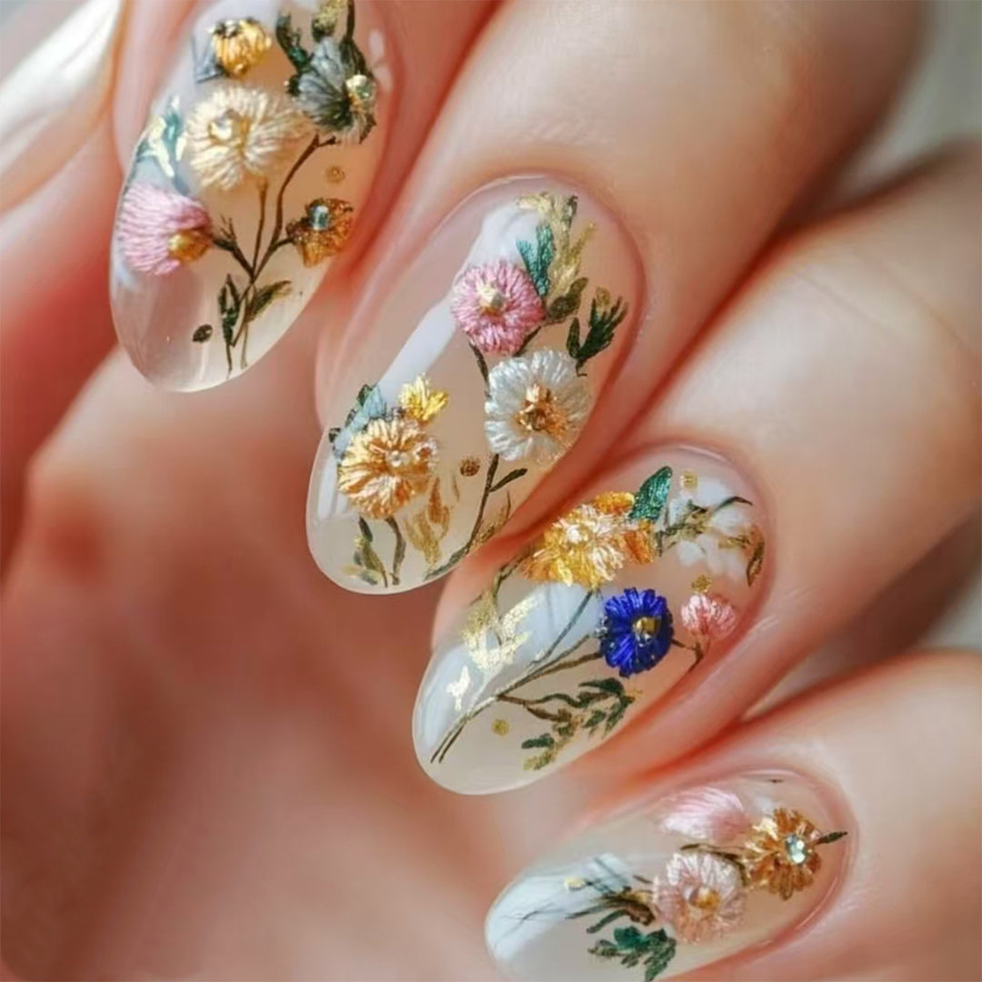 Artificial nails with floral designs and gold accents Stornfield