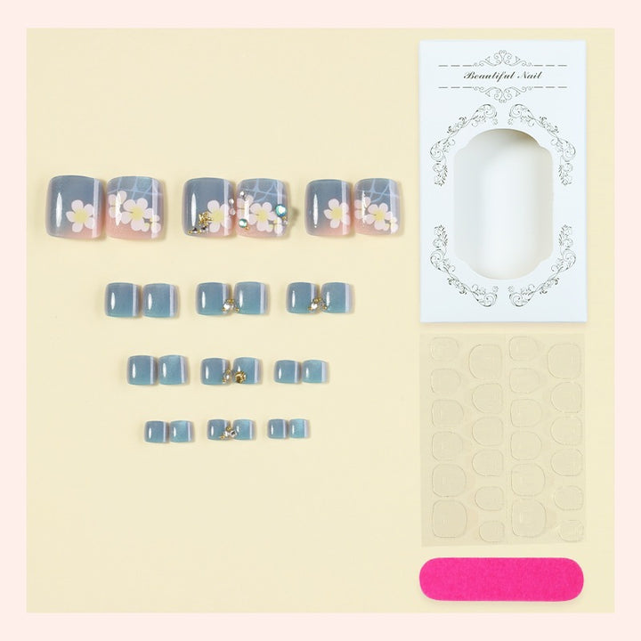 Artificial nail set with floral appliqués and glitter effects Stornfield