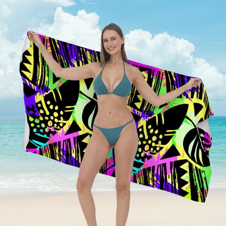 Beach towel with vibrant tropical plant motif Stornfield