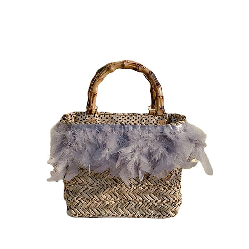 Elegant handbag with feathers and bamboo handles Stornfield