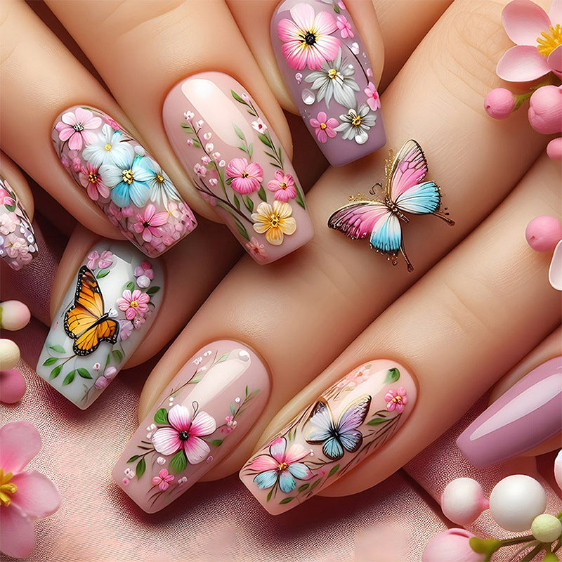 Artificial nail set with floral motifs and butterfly design Stornfield