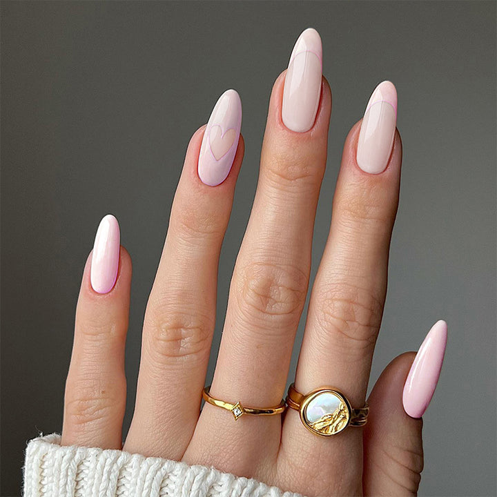 Artful stiletto nails with heart-shaped accents Stornfield