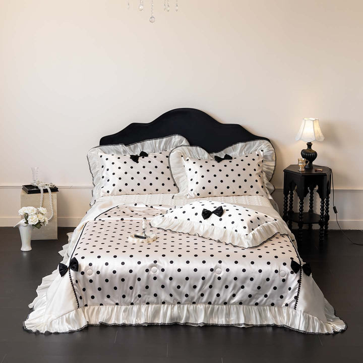 Romantic polka dot satin bedding set with ruffles and decorative ribbons