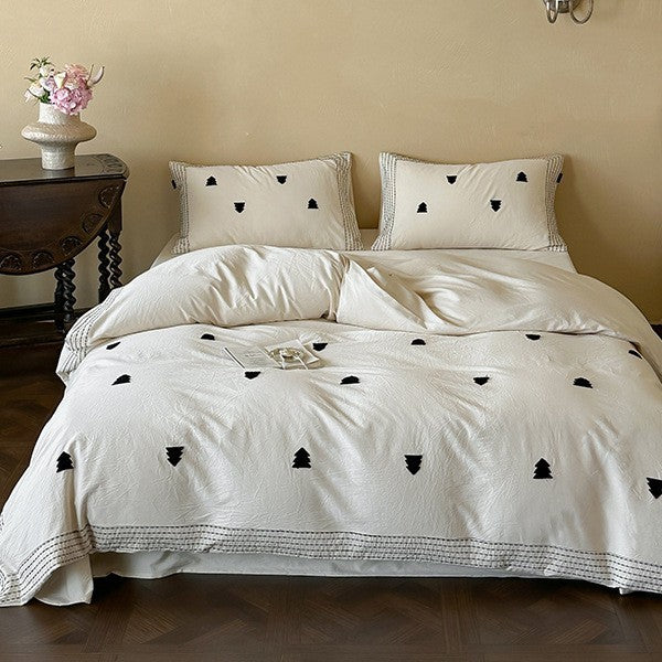 Linen-cotton blend duvet cover set with embroidered accent motifs and striped border