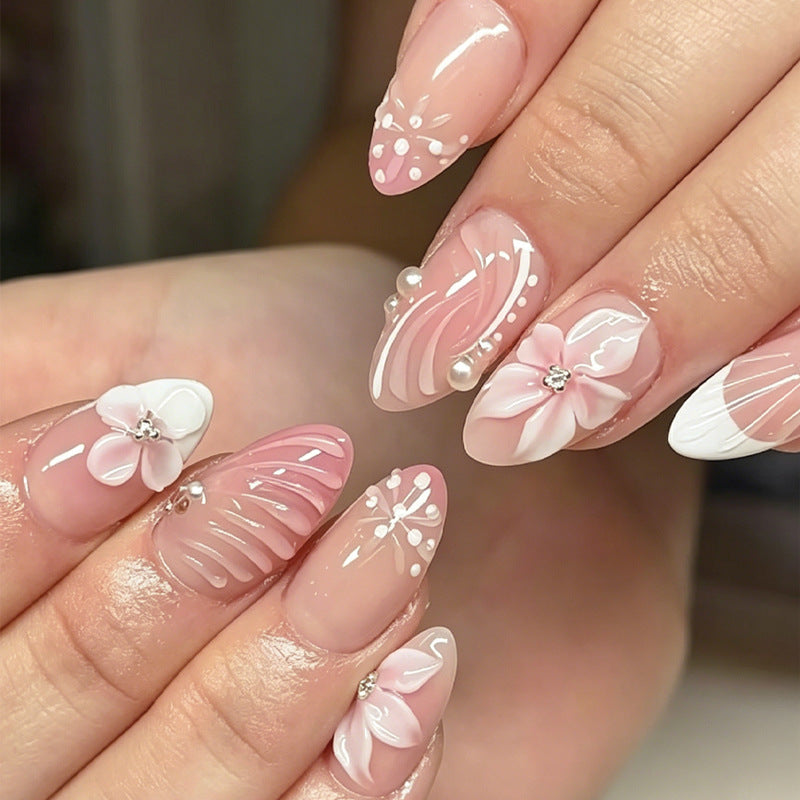 Acrylic nail set with elegant 3D flowers and embellished details Stornfield