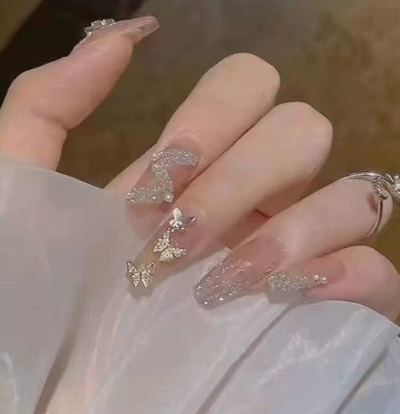 Elegant nail design with pearl embellishment Stornfield