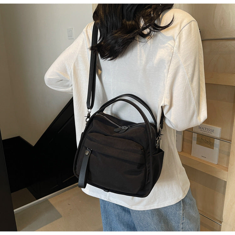 Fashionable shoulder bag with innovative structure and detachable carrying strap Stornfield