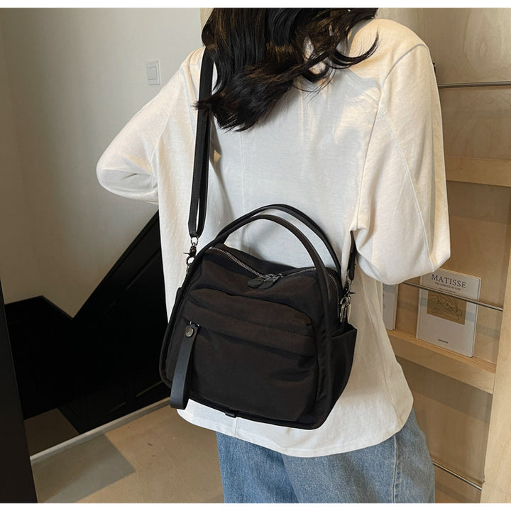 Fashionable shoulder bag with innovative structure and detachable carrying strap Stornfield