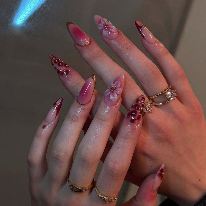 Artificial nails with floral and glitter accents Stornfield