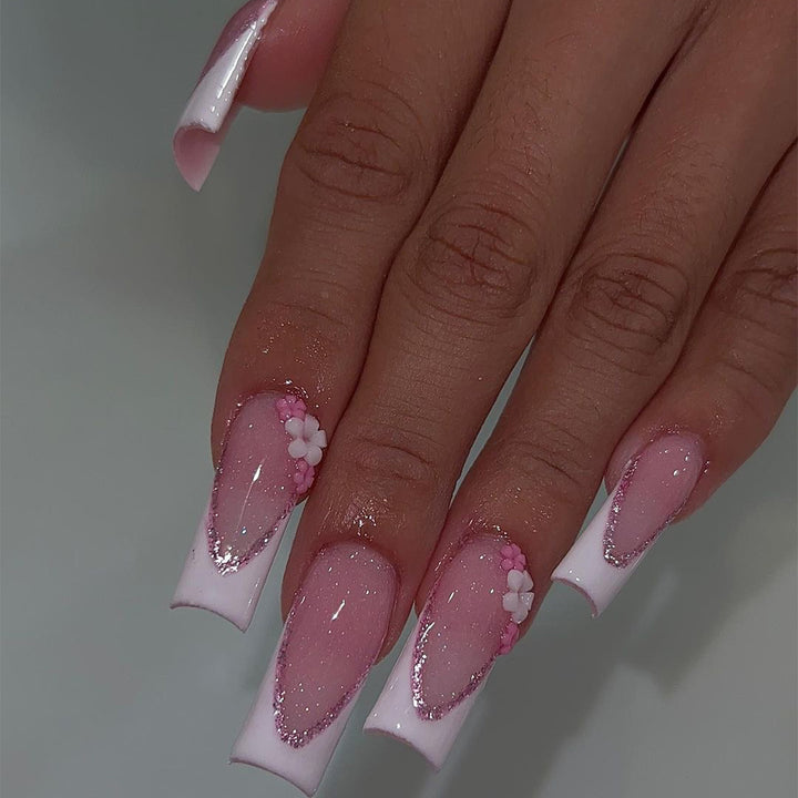Artful Nail Extensions with Glitter and Flower Accents Stornfield