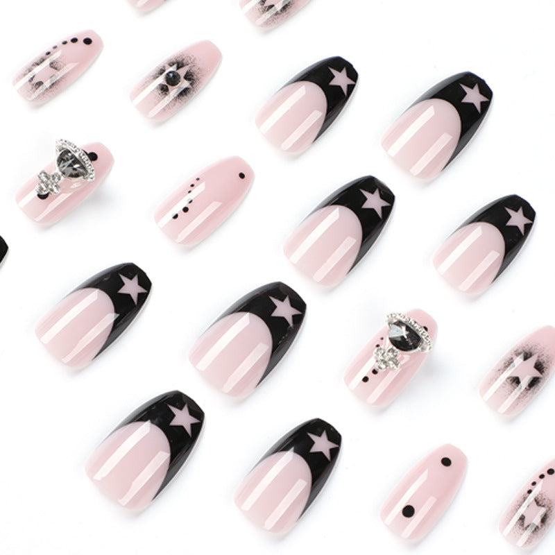 Glamorous nail art with star motifs and glitter accents Stornfield