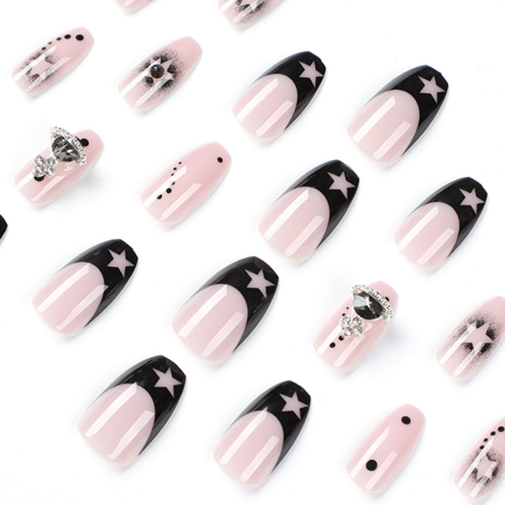 Glamorous nail art with star motifs and glitter accents Stornfield