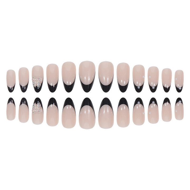 Artificial nail set with glossy French design and delicate 3D accents Stornfield
