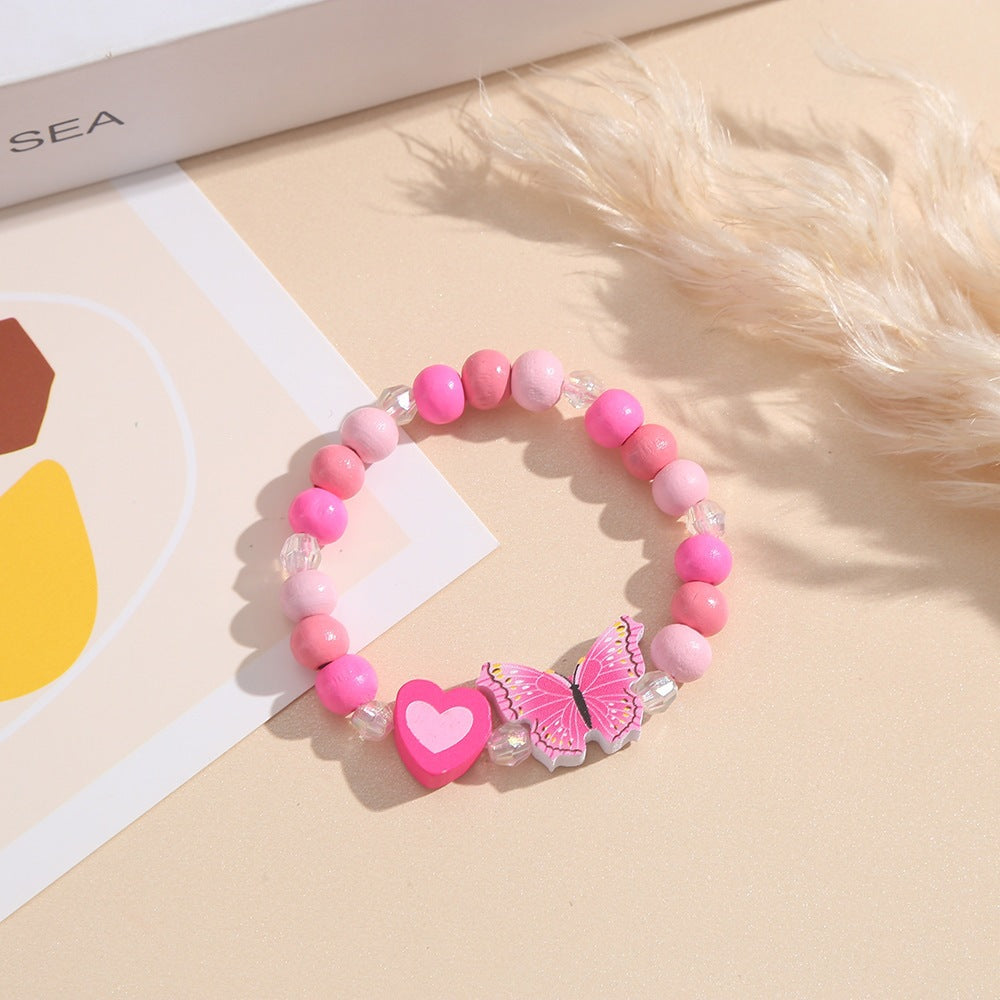 Playful bracelet with heart and butterfly charms Stornfield