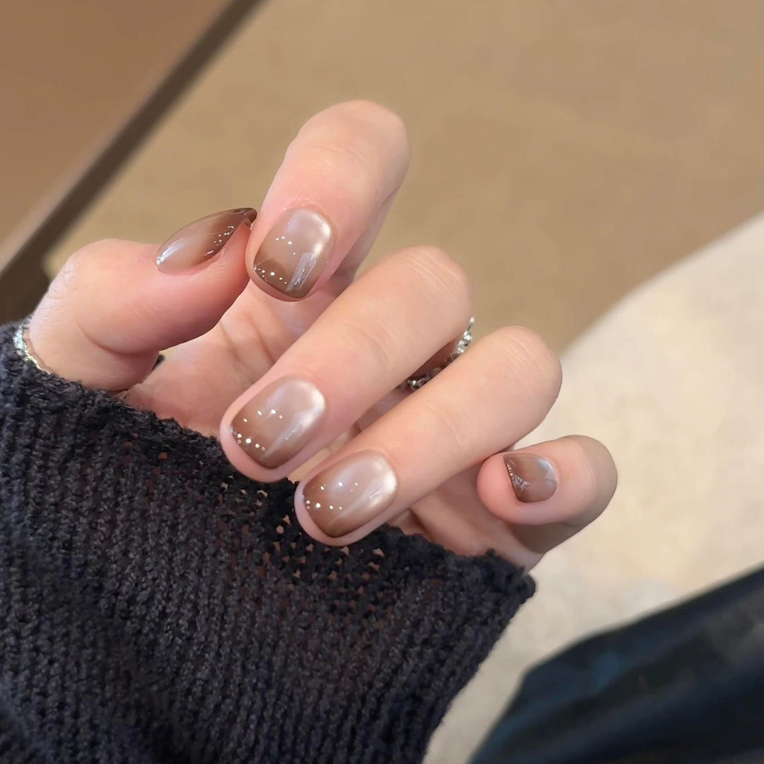 Artificial nails with elegant gradient color and glitter elements Stornfield