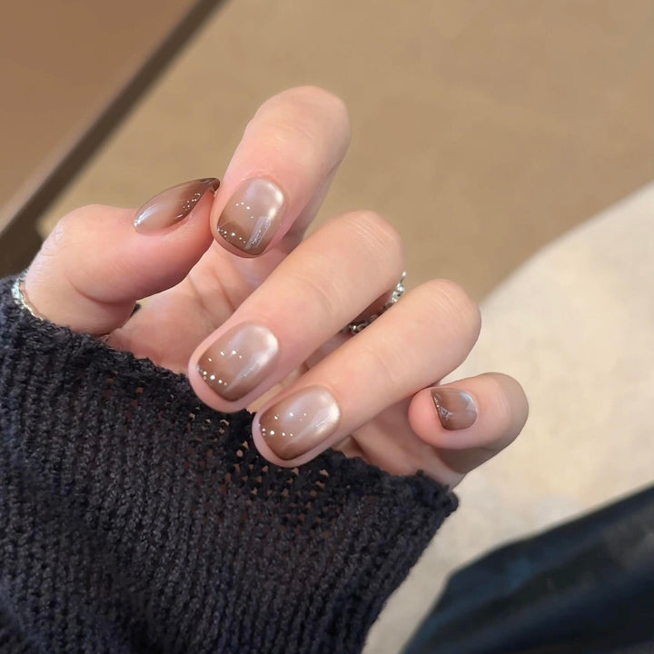 Artificial nails with elegant gradient color and glitter elements Stornfield