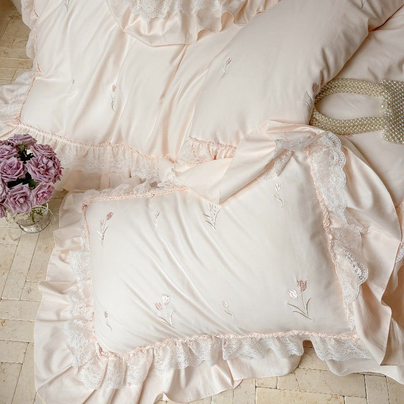 Romantic cotton bedding set with ruffles and delicate floral embroidery