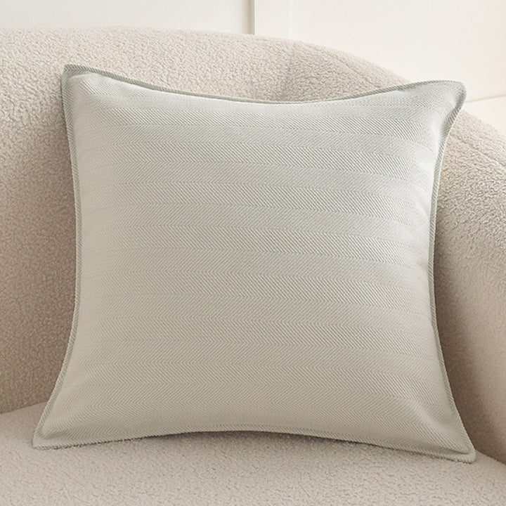 Square decorative cover with fine herringbone pattern and piping edge Stornfield