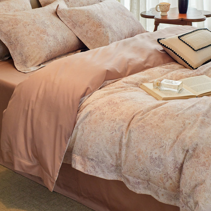 Luxurious cotton satin bed linen set with millefleurs floral pattern and fine piping