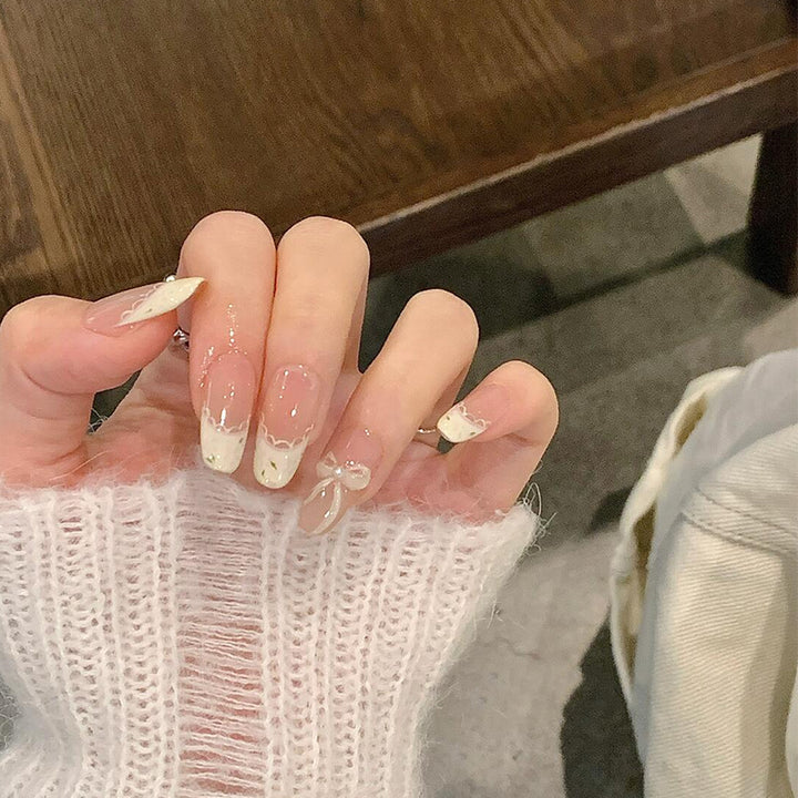 Artificial nails with elegant tip embellishment and romantic details Stornfield