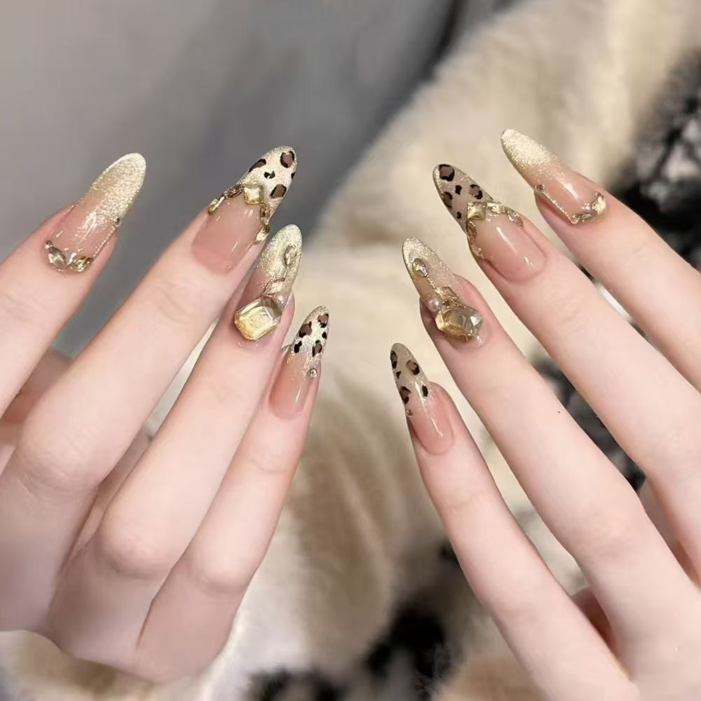 Artificial nails with elegant leopard design and glitter effects Stornfield