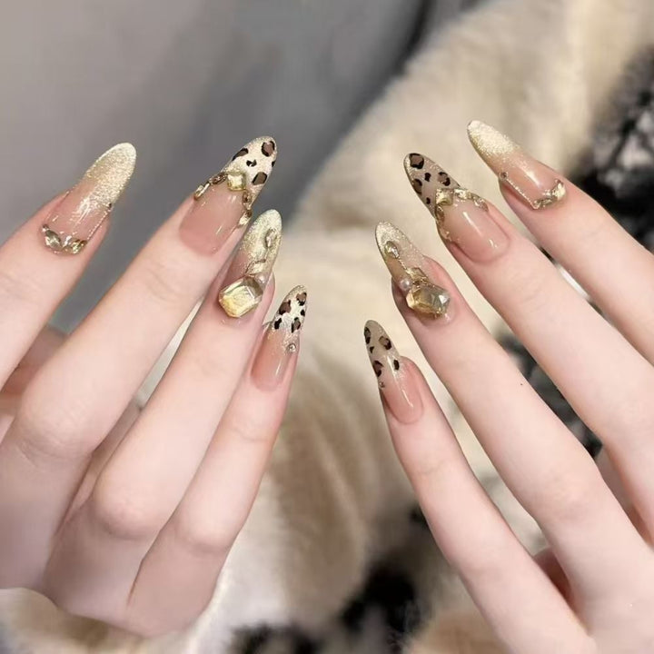 Artificial nails with elegant leopard design and glitter effects Stornfield