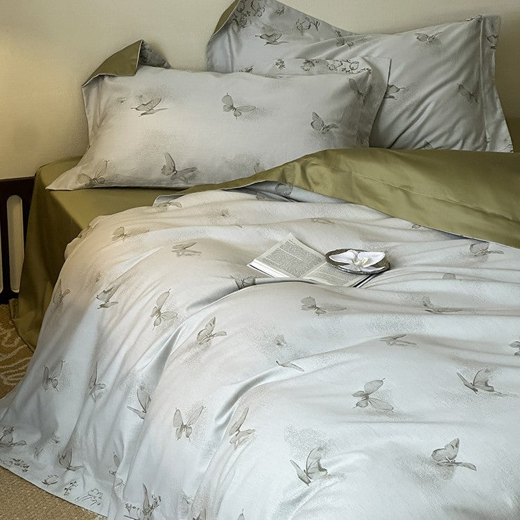 Elegant finely woven bedding set made of Mako satin with subtle butterfly jacquard structure and reversible pillowcase