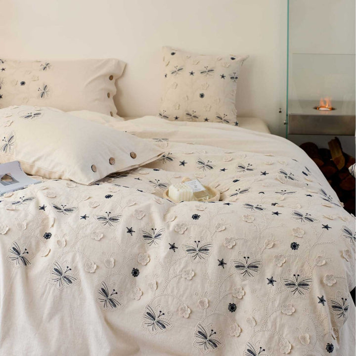 Embroidered cotton bedding set with wooden buttons and butterfly appliqués