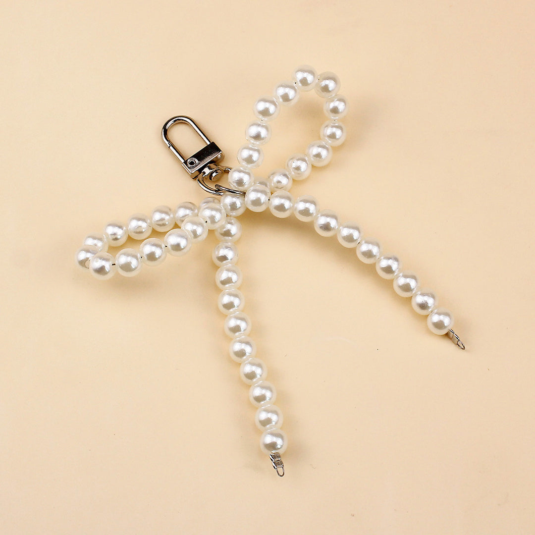 Elegant Pearl Bow Brooch Stornfield