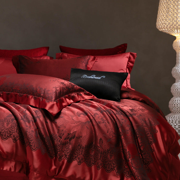 Luxurious satin bedding set with jacquard lace pattern and decorative pillow