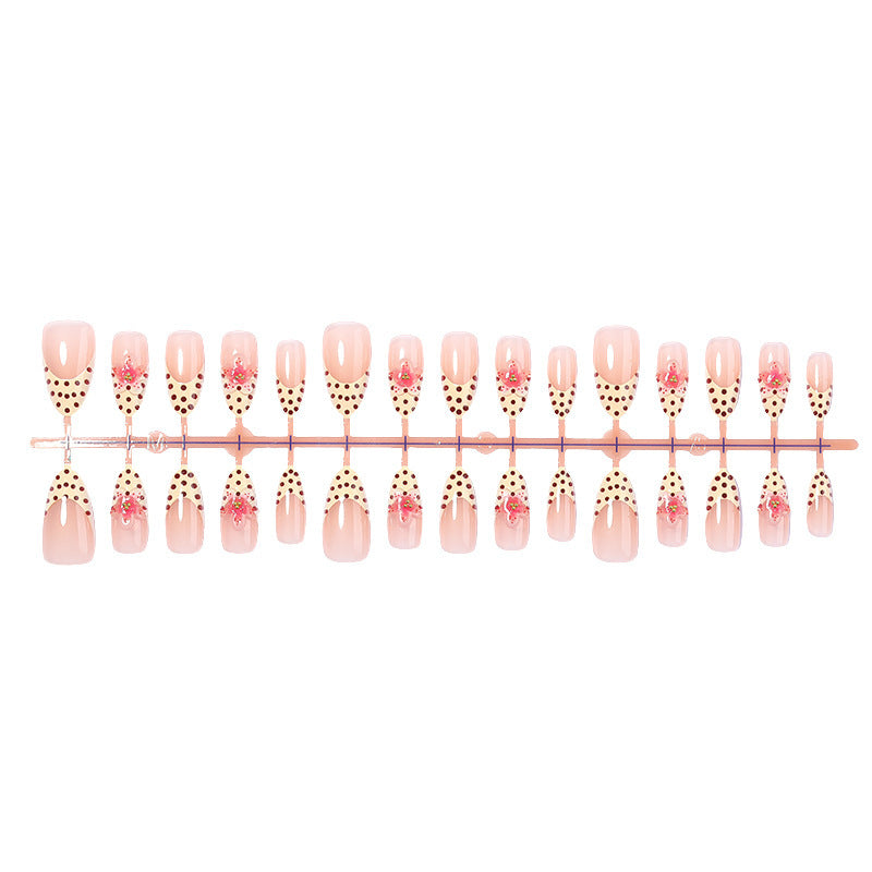 Acrylic nail set with romantic dots and floral accents Stornfield