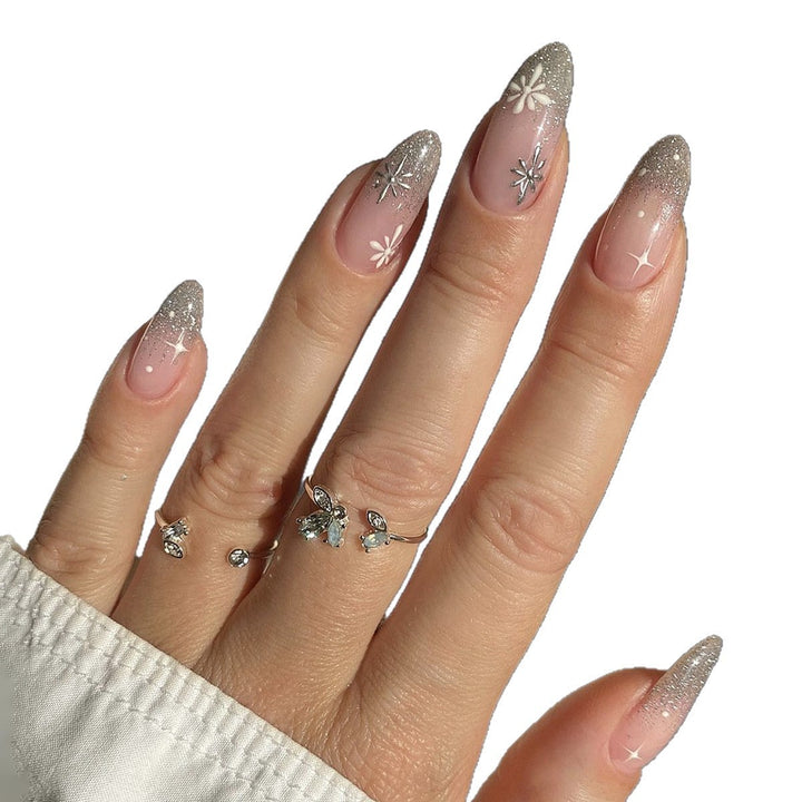 Nail art set with elegant glitter French design and artistic embellishments Stornfield