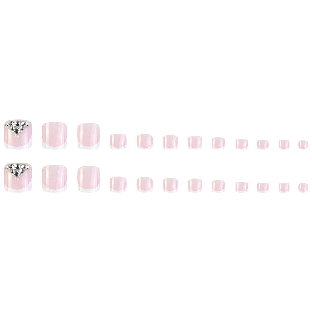 Nail art set with elegant French tips and sparkling rhinestone details Stornfield