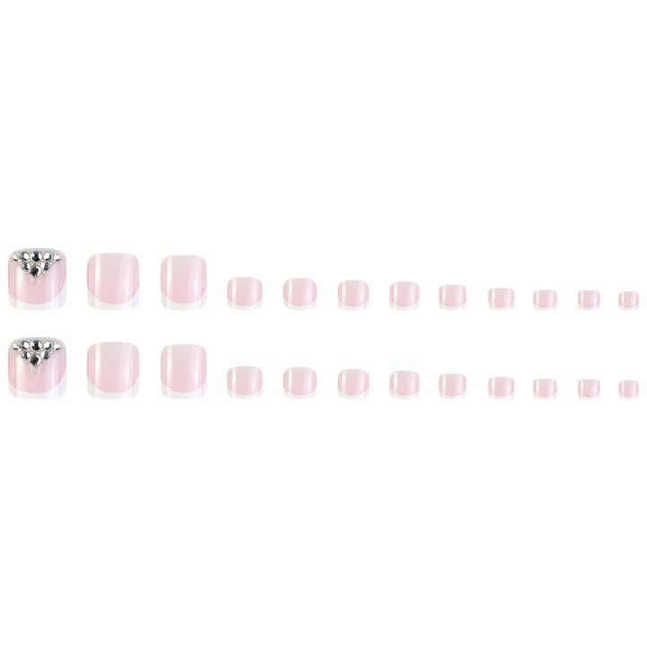Nail art set with elegant French tips and sparkling rhinestone details Stornfield