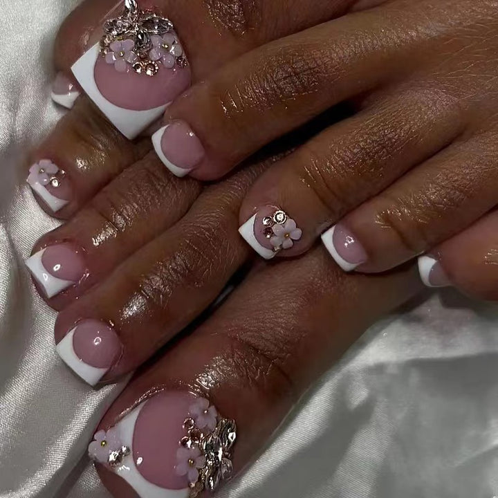 Acrylic nail set with elegant 3D flowers and glitter accents Stornfield