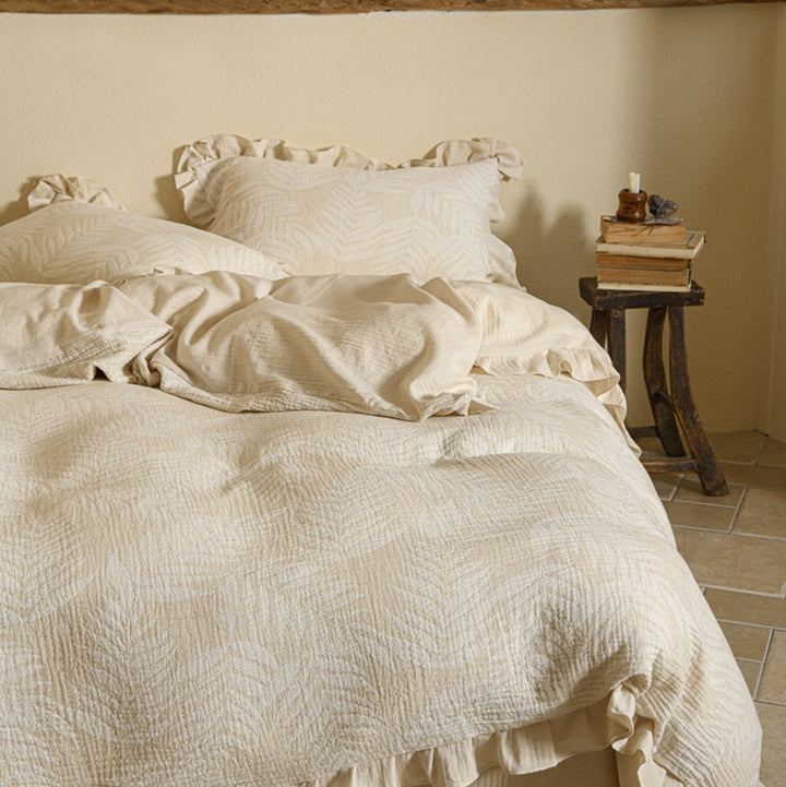 Vintage-inspired linen bedding set with subtle floral damask & ruffle