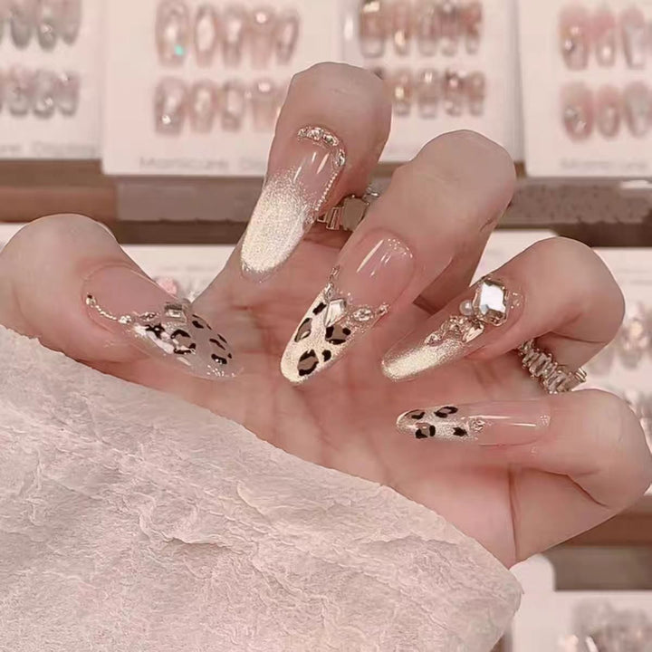 Glamorous artificial nails with creative 3D applications Stornfield
