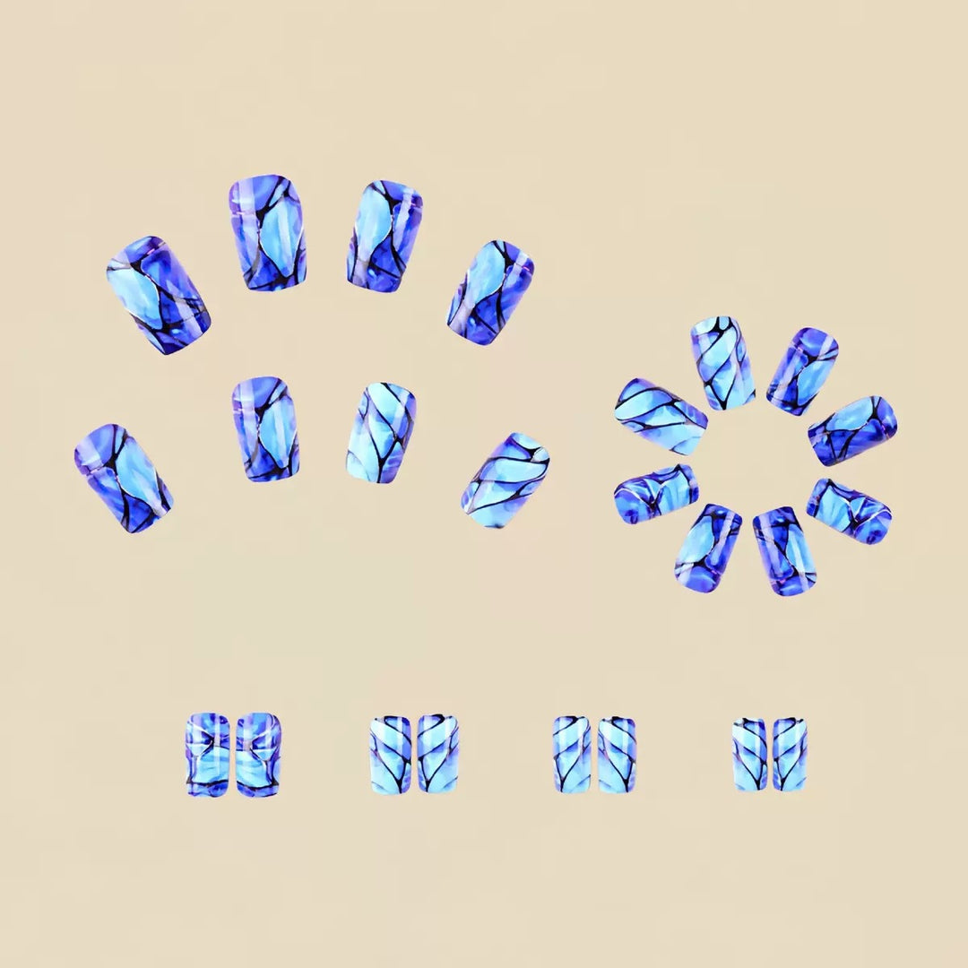 Acrylic nail set with luxurious marble design and elegant accents Stornfield