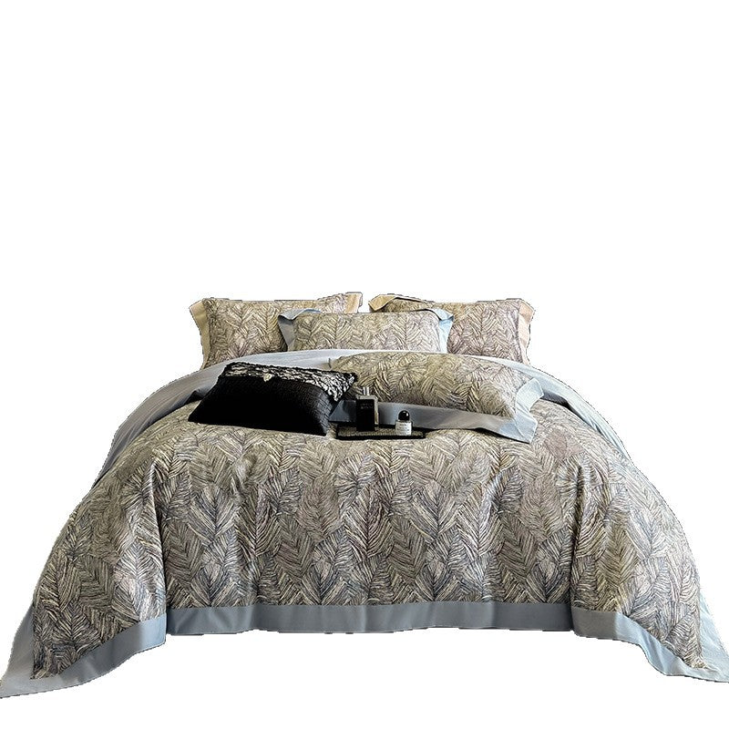 Elegant bed linen set made of cotton satin with a subtle leaf pattern and contrast piping