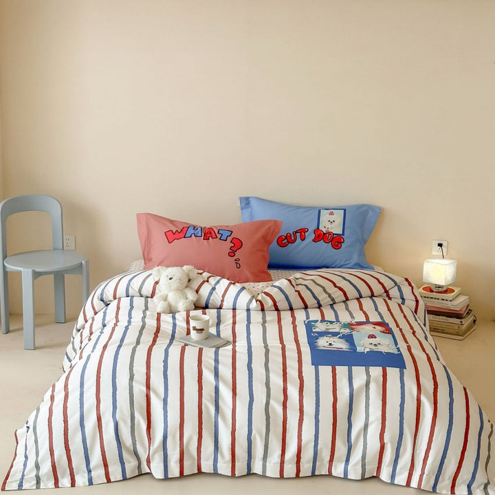 Bedding set for children made of cotton satin with contrasting piping and puppy print