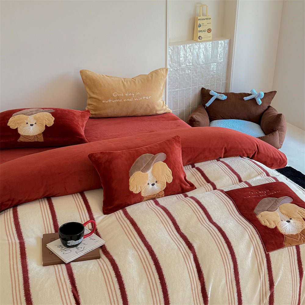 Plush bedding set with embroidered dog motif and striped cuddle blanket