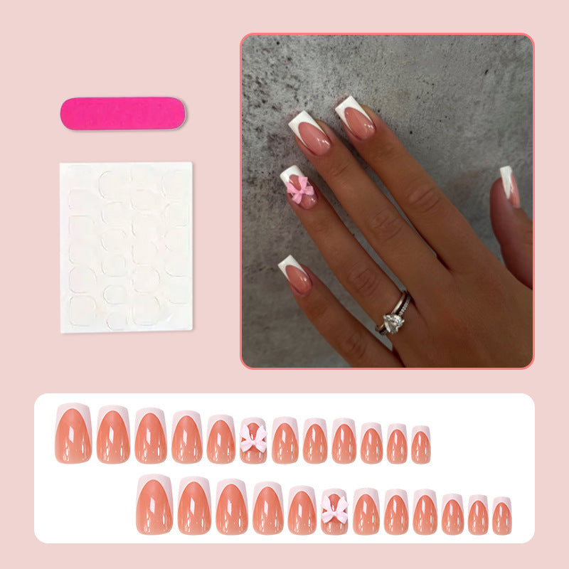 Acrylic nail set with elegant tips and playful bows Stornfield