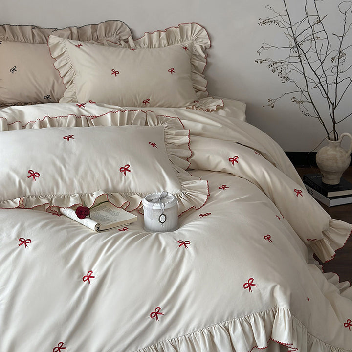 Luxurious bed linen set with ruffles and embroidered bows