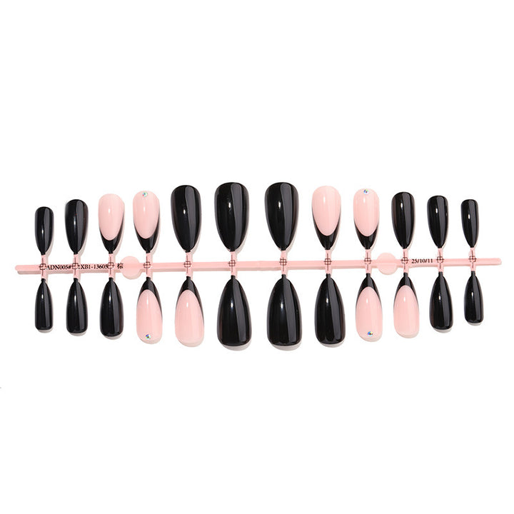 Acrylic nail set with elegant black-pink design and rhinestone-embellished accents Stornfield