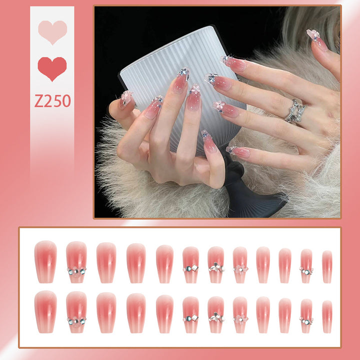 Artificial nail set with glamorous 3D decorations and shimmering accents Stornfield