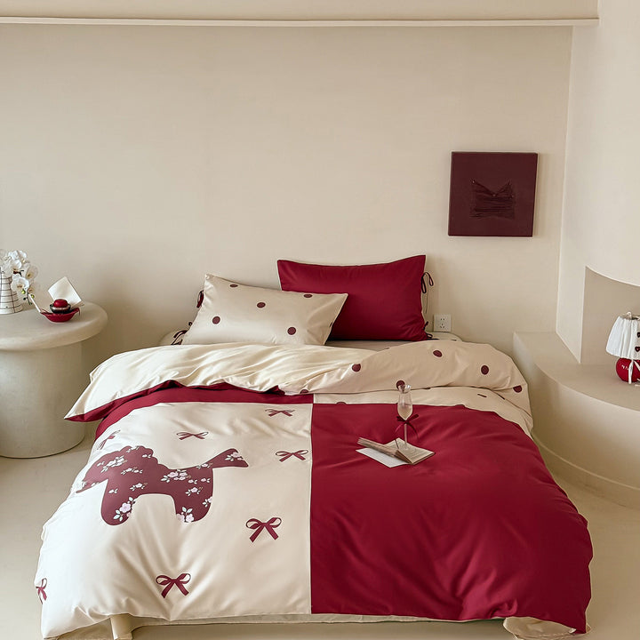 Reversible bedding set with decorative dog and dot pattern as well as pillowcases with ties